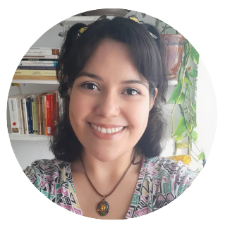 Portrait of a woman, Lidia Ponce de la Vega, with dark hair in a flowered shirt.